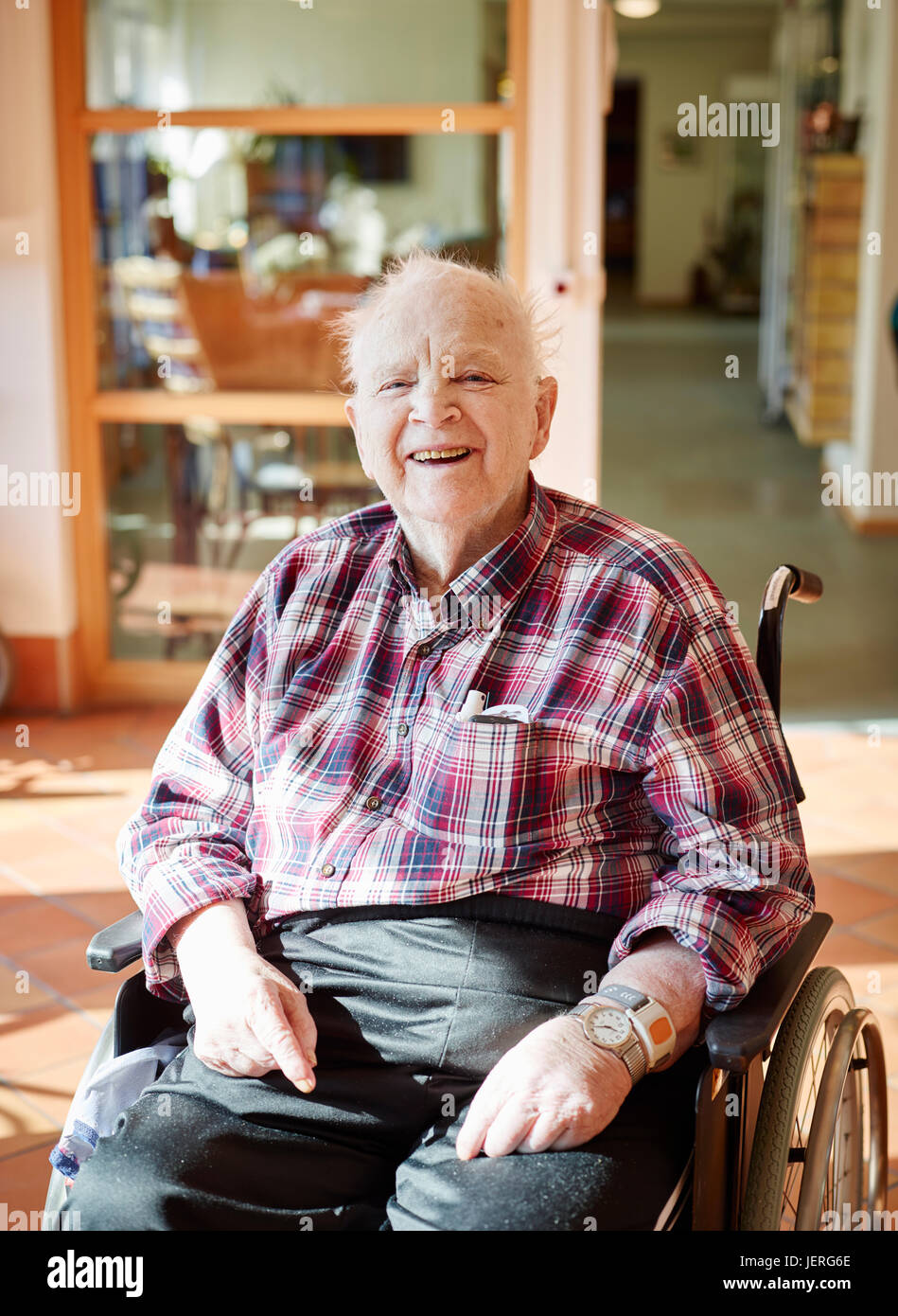 Smiling senior man on wheelchair Stock Photo