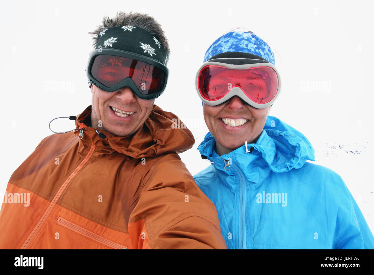 Smiling couple wearing skiing goggles Stock Photo