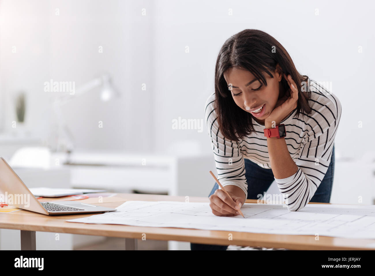 Hard working smart woman concentrating on her project Stock Photo