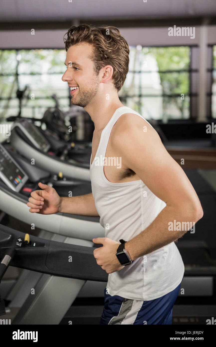 Man running on thread mill Stock Photo - Alamy