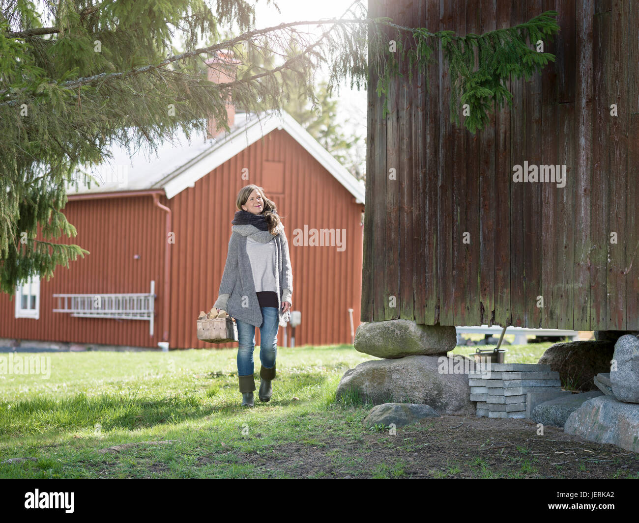 Woman farmer holding basket hi-res stock photography and images - Alamy