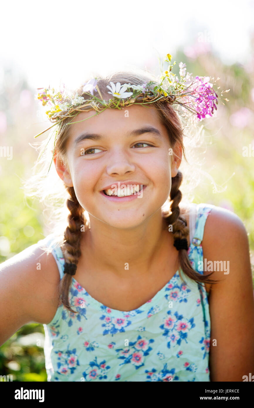 Girl wearing flower wreath Stock Photo - Alamy