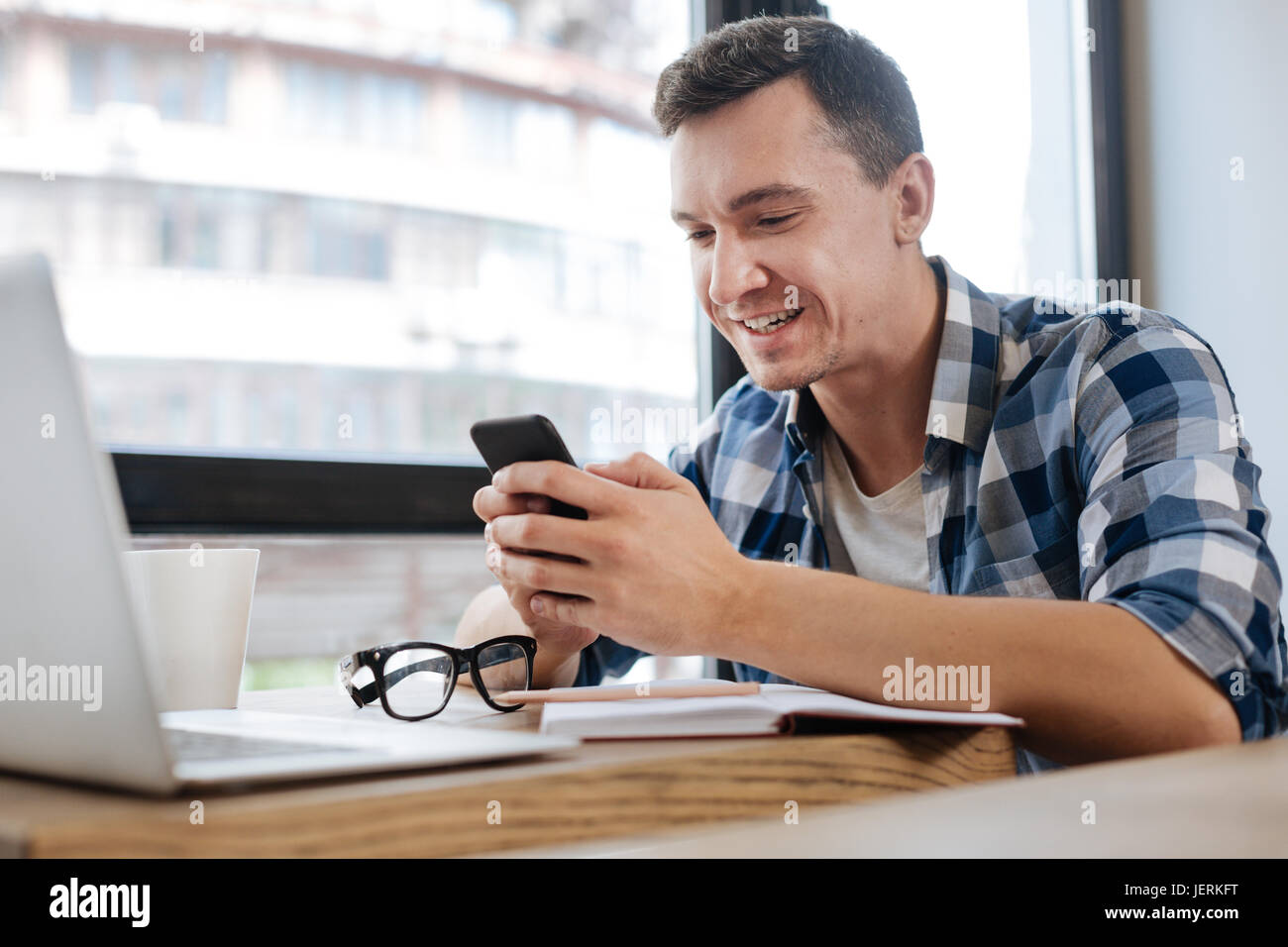 Relaxed engaged guy checking updates stock photo alamy