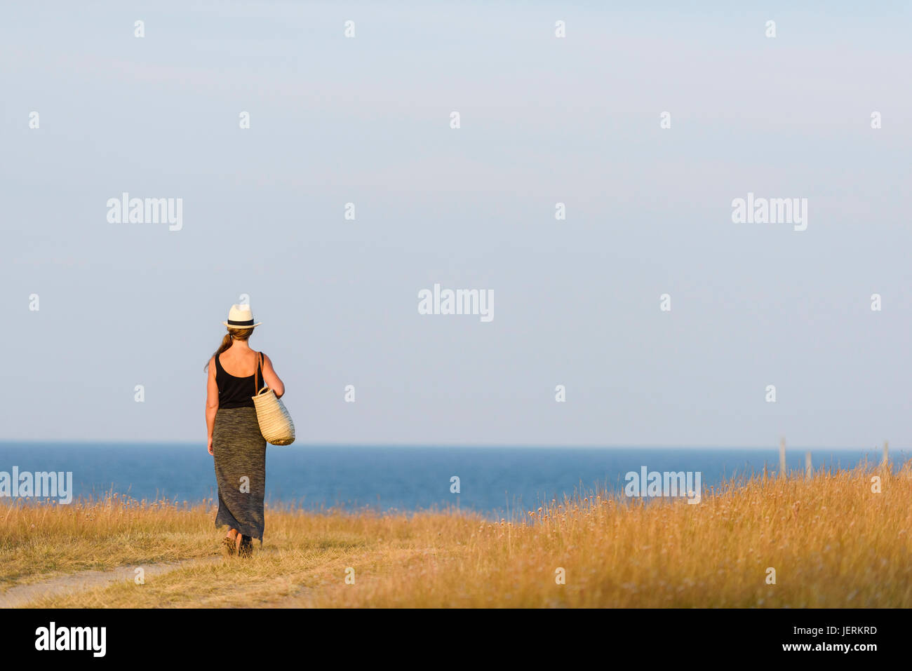 Woman looking at sea Stock Photo - Alamy