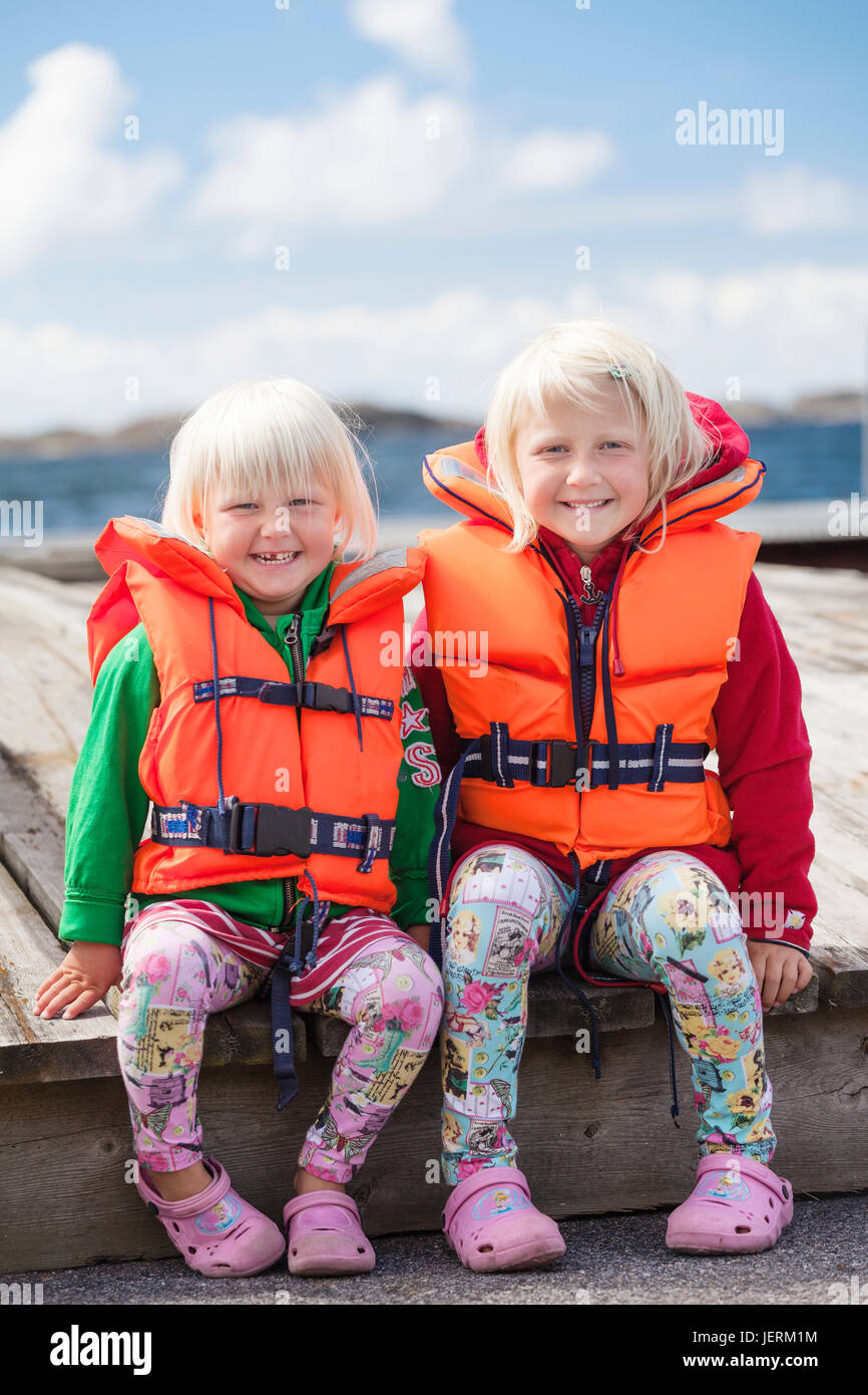 Girls wearing life jackets Stock Photo Alamy