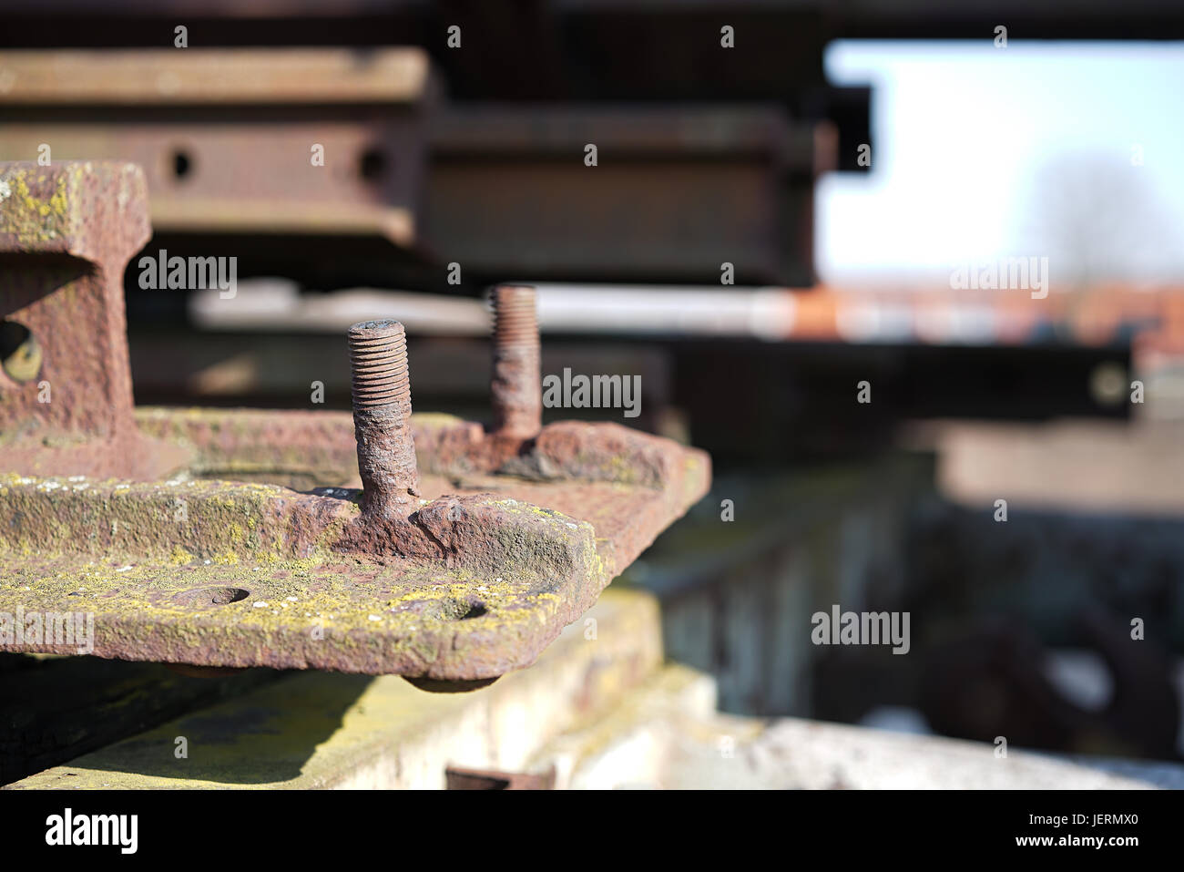 rusted component with screws at a junkyard Stock Photo