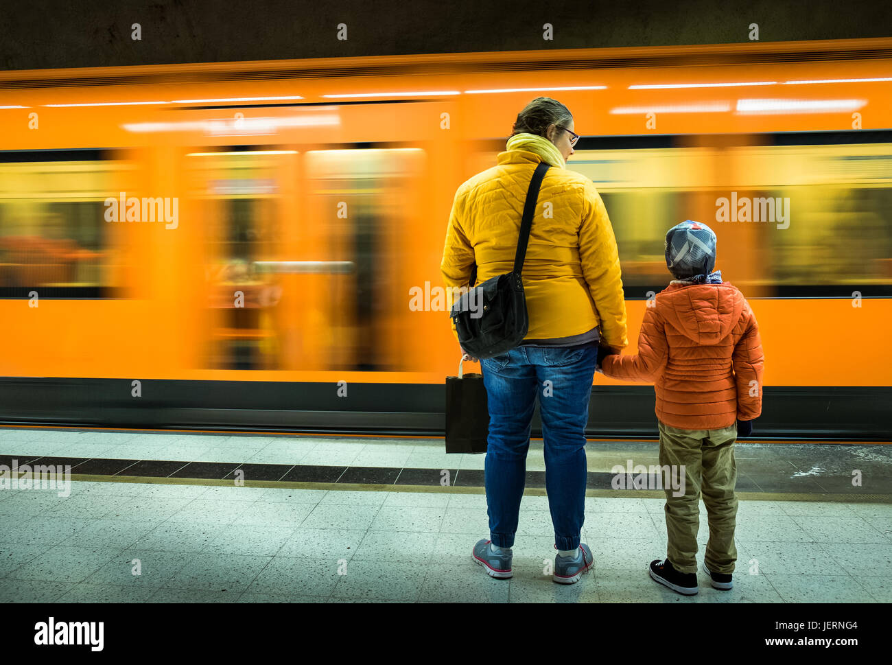 Mother and child waiting a metrotrain in Helsinki metro station Stock Photo