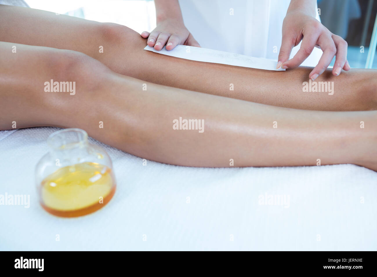 Woman getting her legs waxed Stock Photo Alamy