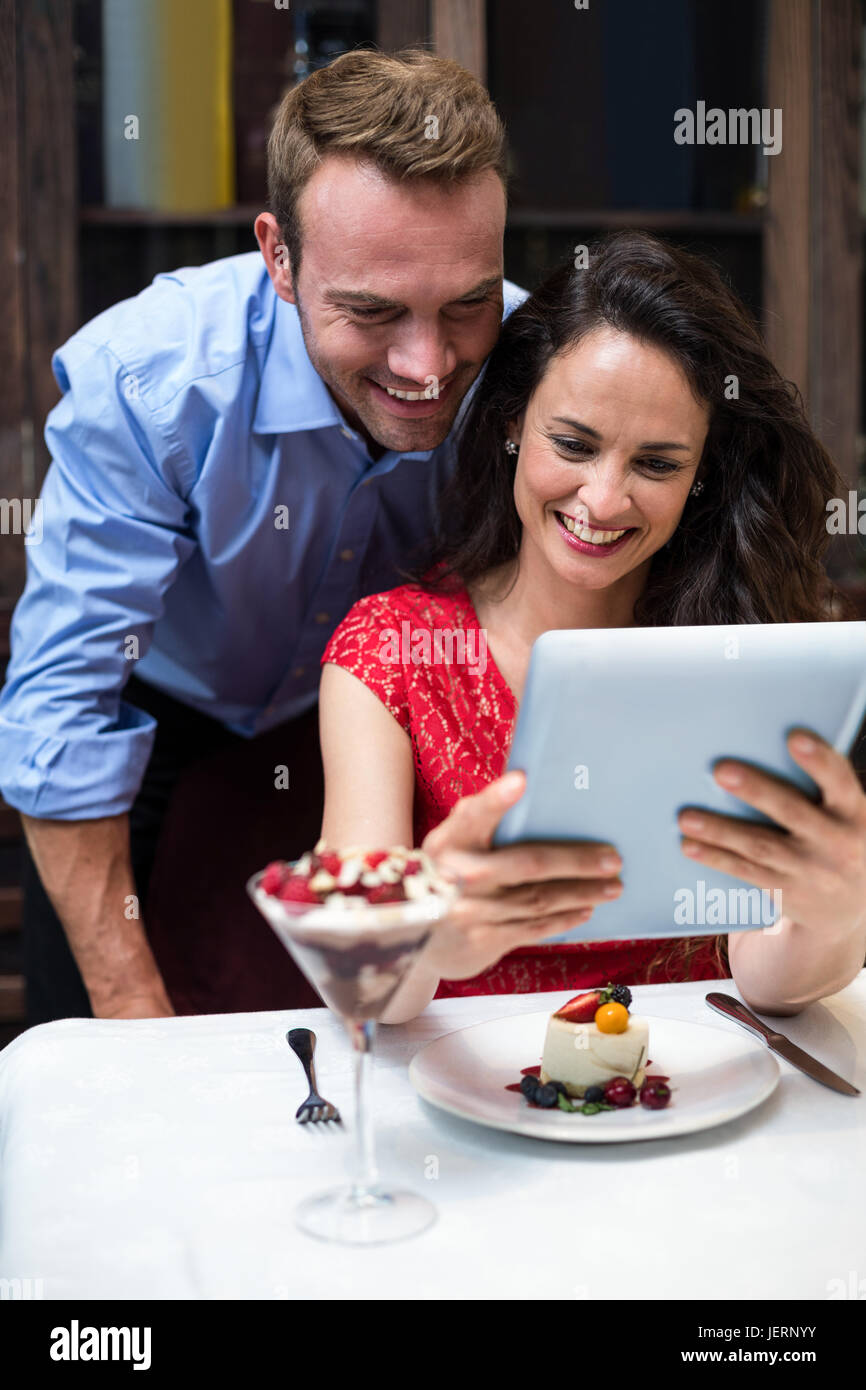 Happy couple using digital tablet Stock Photo