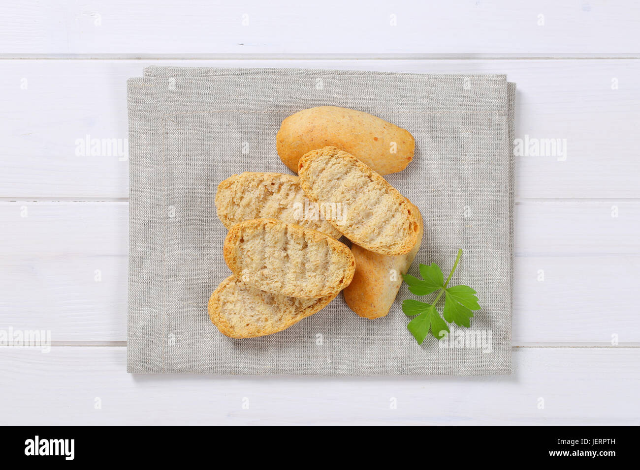 pile of crispy rusks on beige place mat Stock Photo