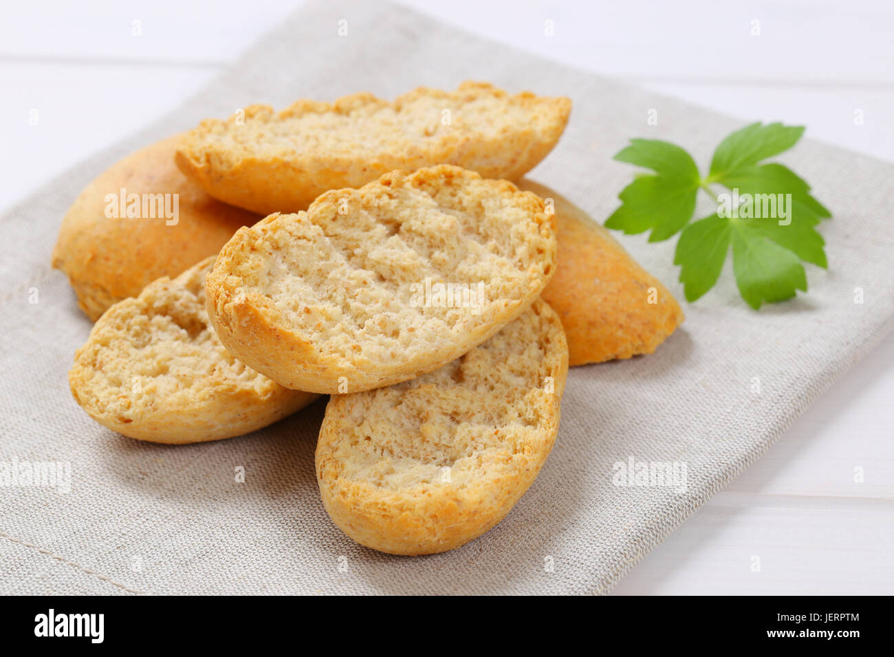 pile of crispy rusks on beige place mat - close up Stock Photo