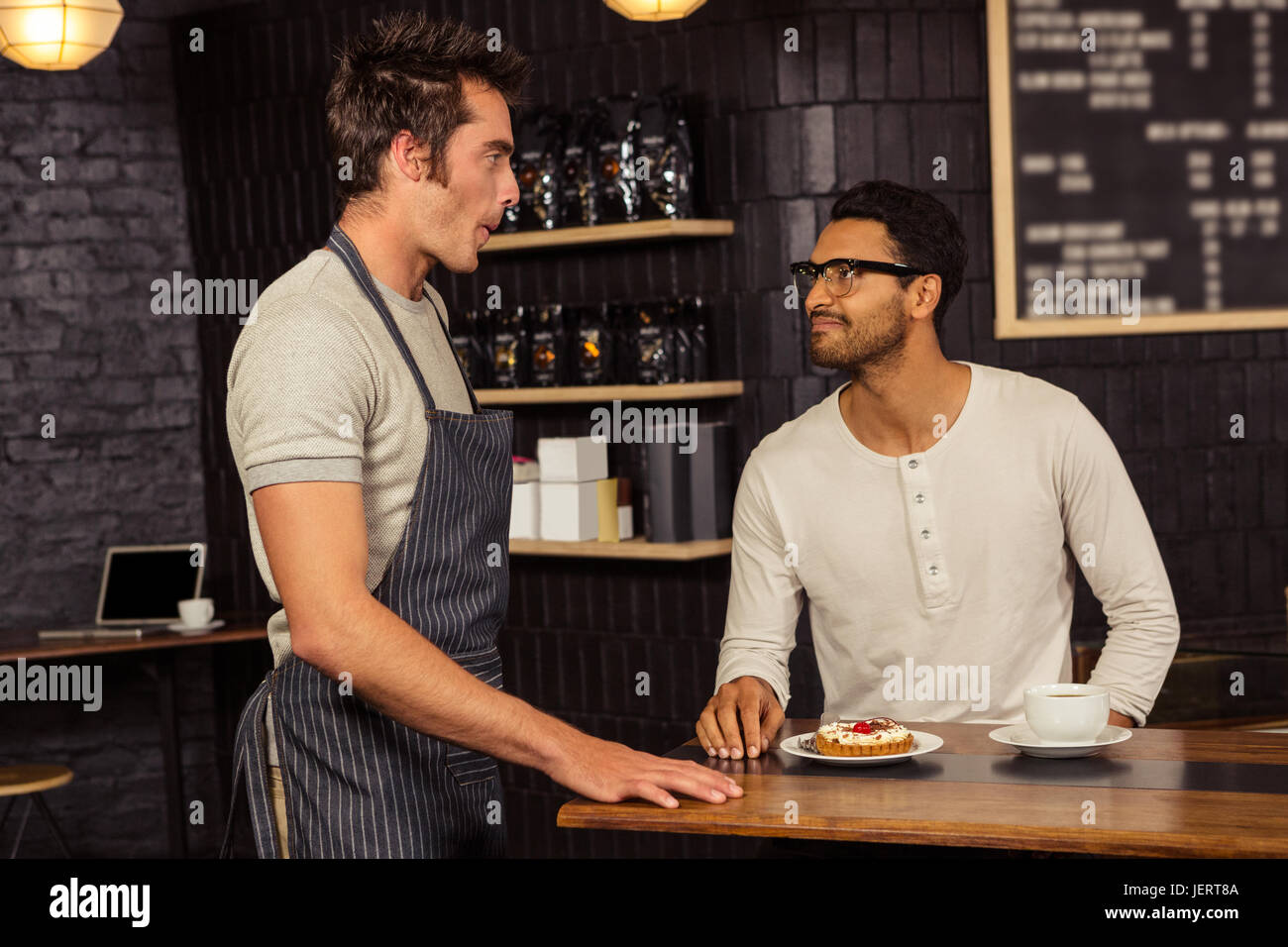 Waiter and customer talking Stock Photo Alamy