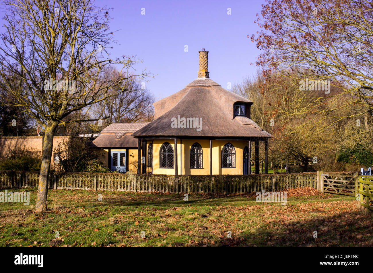 A thatched cottage which was once at the entrance to an estate. Stock Photo