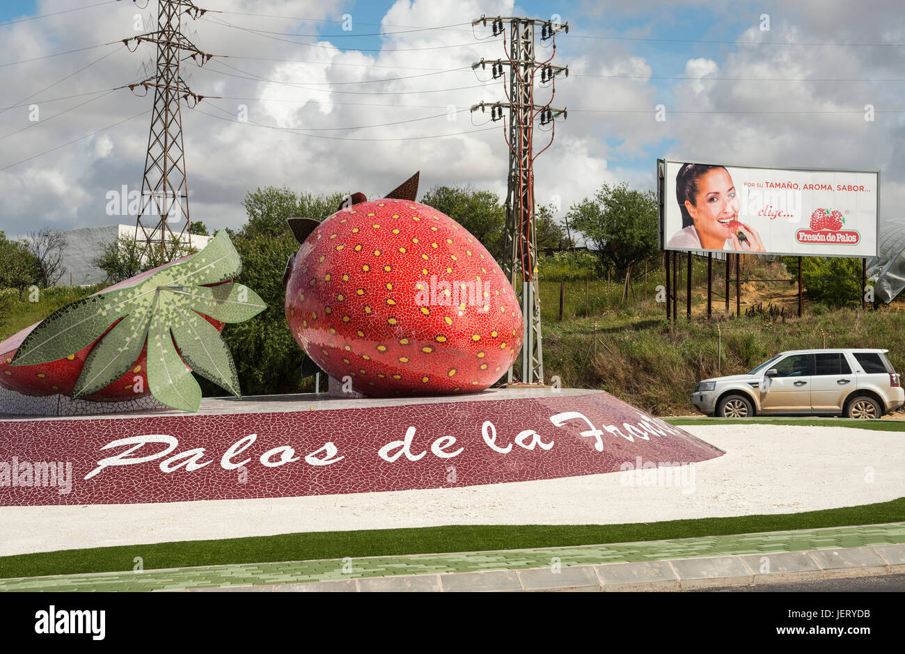 A roundabout with giant strawberry sculpture in Palos de la Frontera,  A main centre for strawberry production in Huelva province, Andalucia, Spain Stock Photo