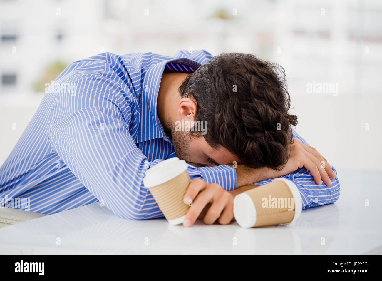 Businessman Putting His Head Down On Desk Stock Photo 146814628