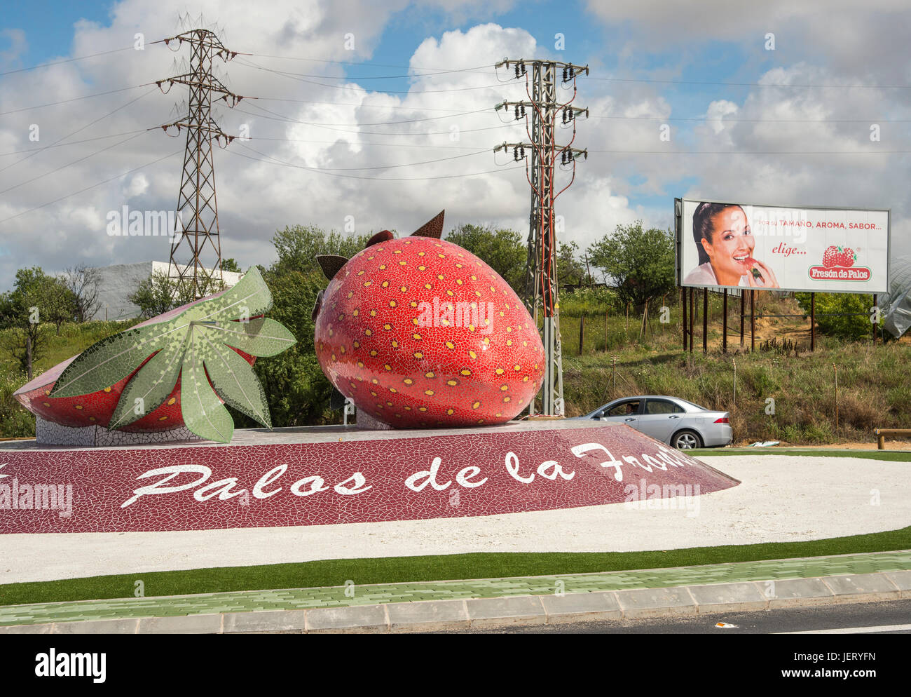 A roundabout with giant strawberry sculpture in Palos de la Frontera,  A main centre for strawberry production in Huelva province, Andalucia, Spain Stock Photo