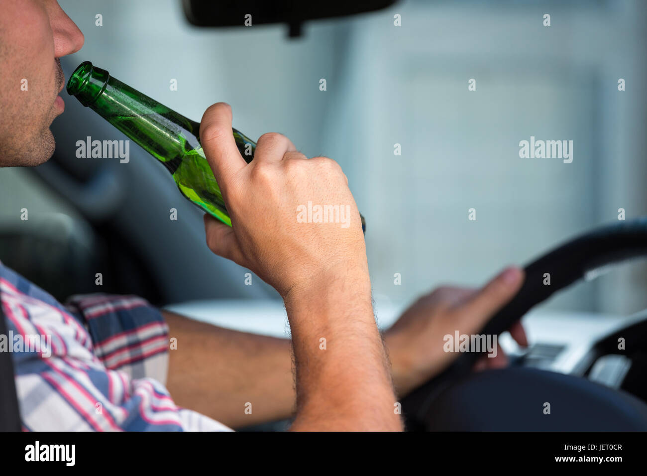 Man drinking beer while driving Stock Photo Alamy