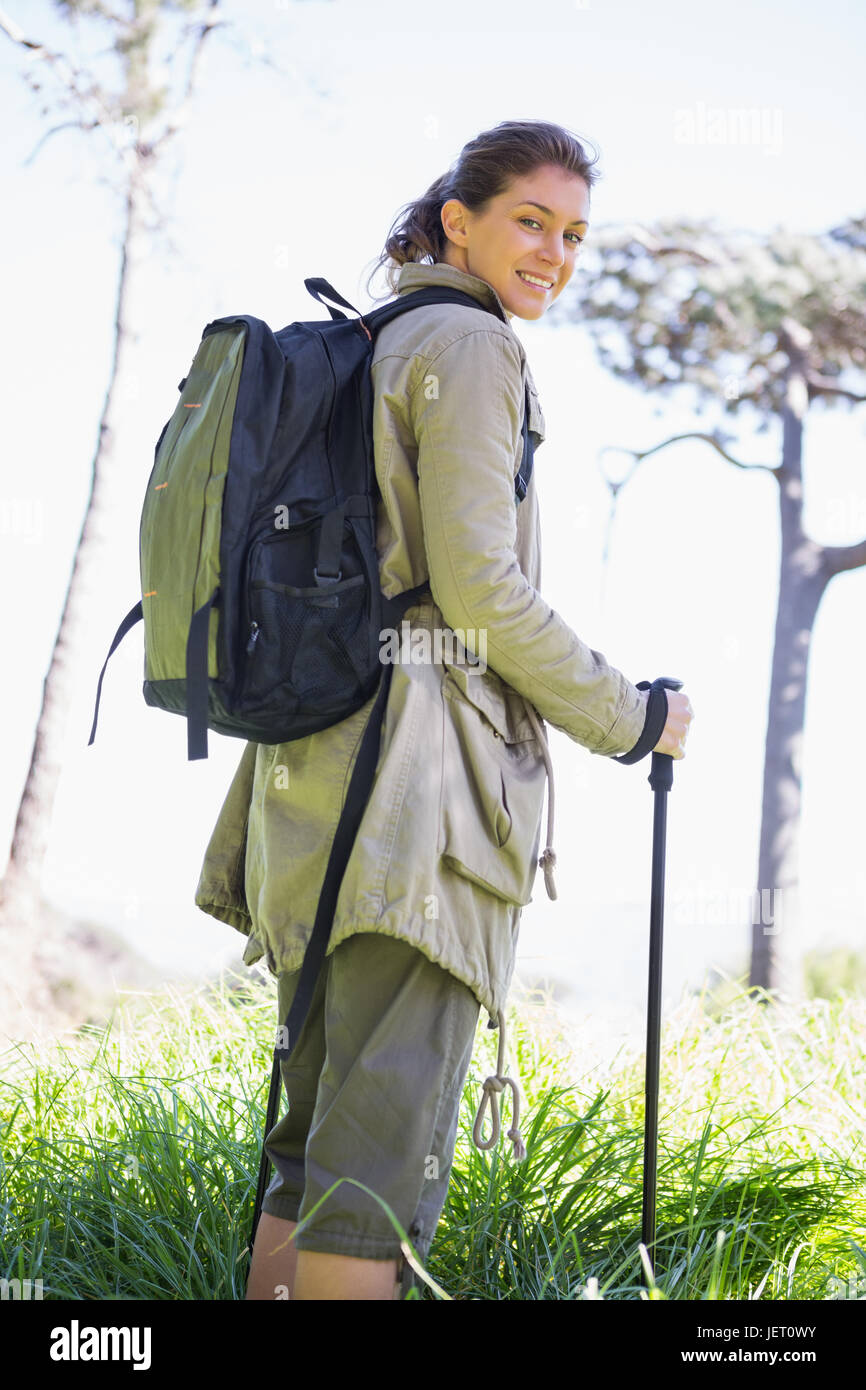 Woman with hiking sticks Stock Photo