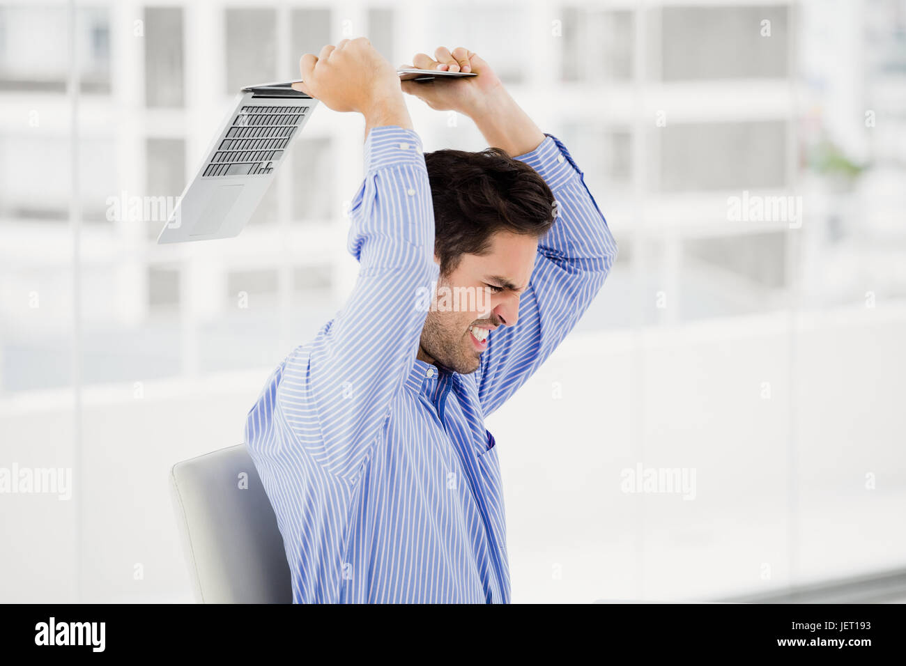 Man throwing chair hires stock photography and images Alamy