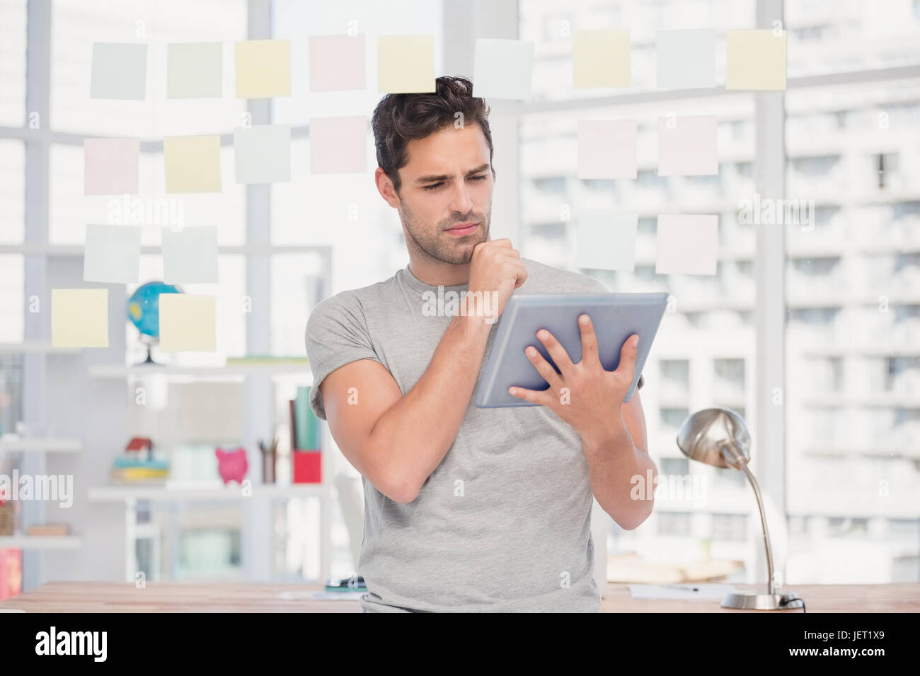 Man holding digital tablet and sticky notes Stock Photo - Alamy