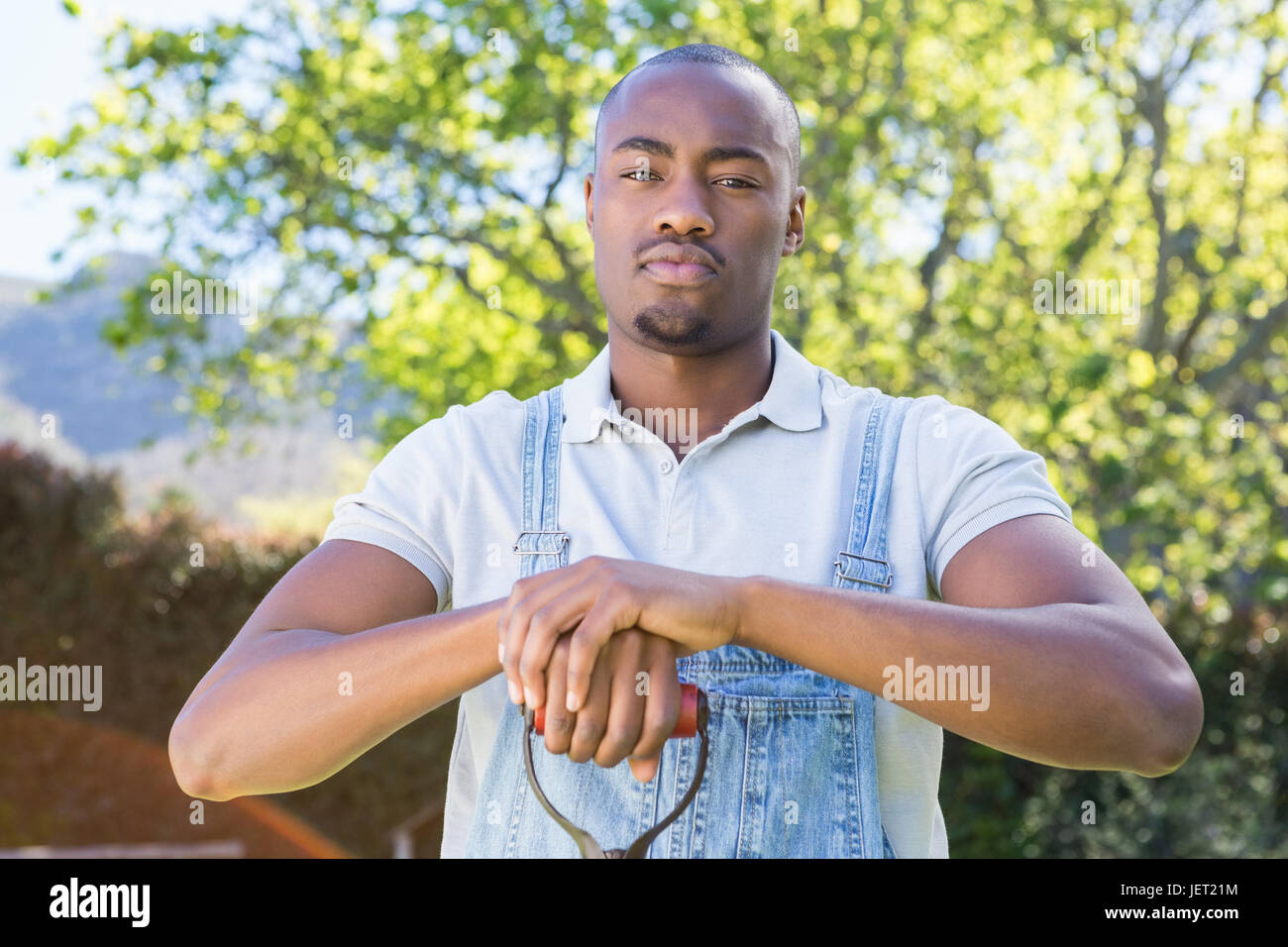 Young man posing shovel hi-res stock photography and images - Alamy