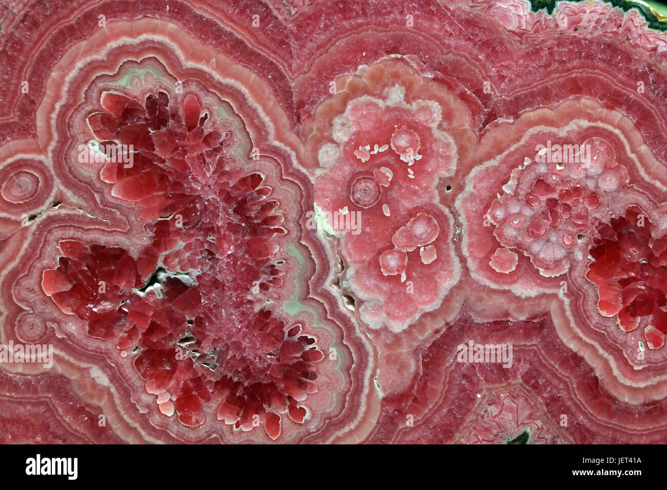 Rhodochrosite pink rose red stone is a manganese carbonate mineral with chemical composition MnCO3 Stock Photo