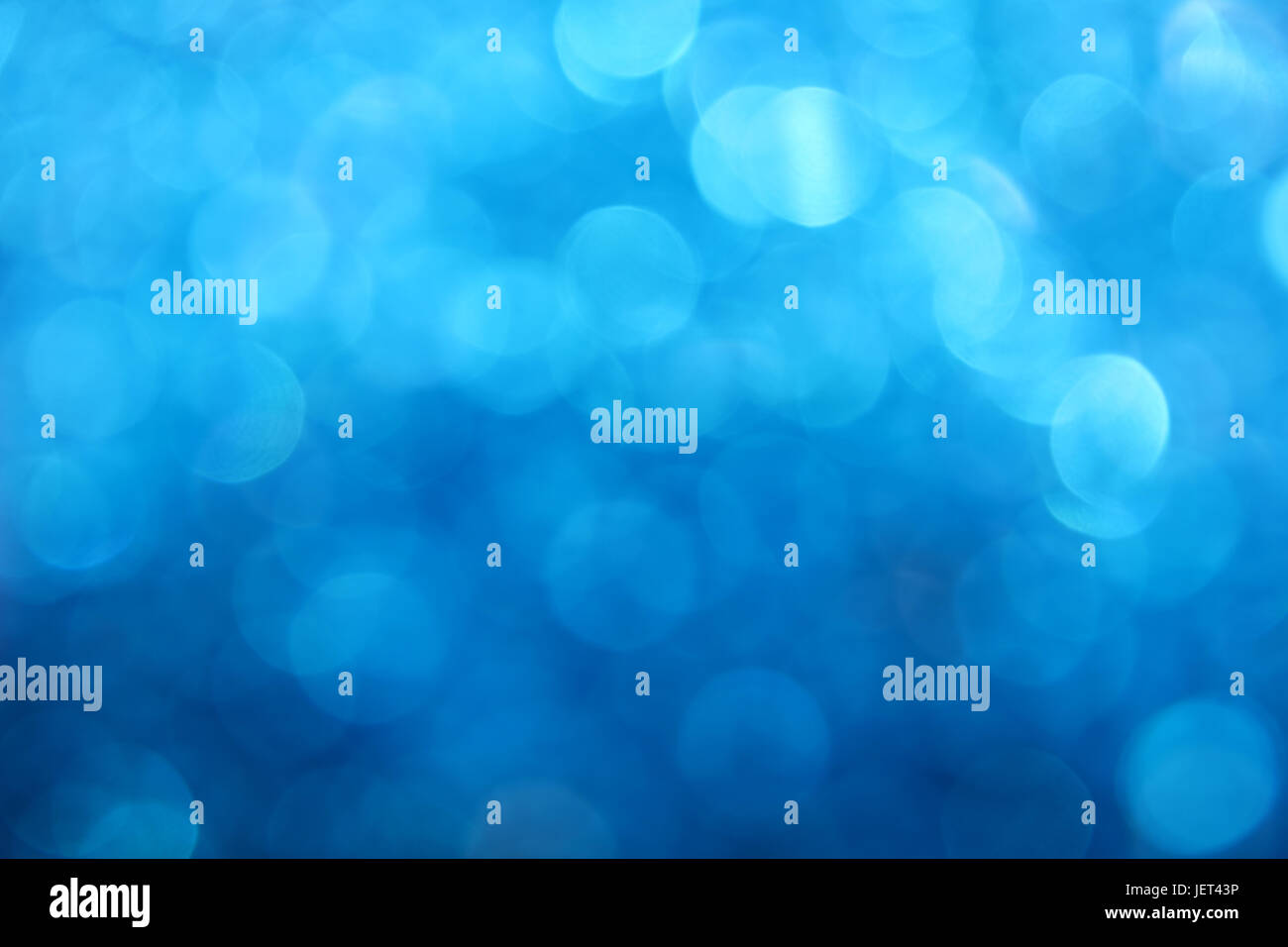 Blue winter snow bokeh defocused blurred lights and sparkles abstract ...