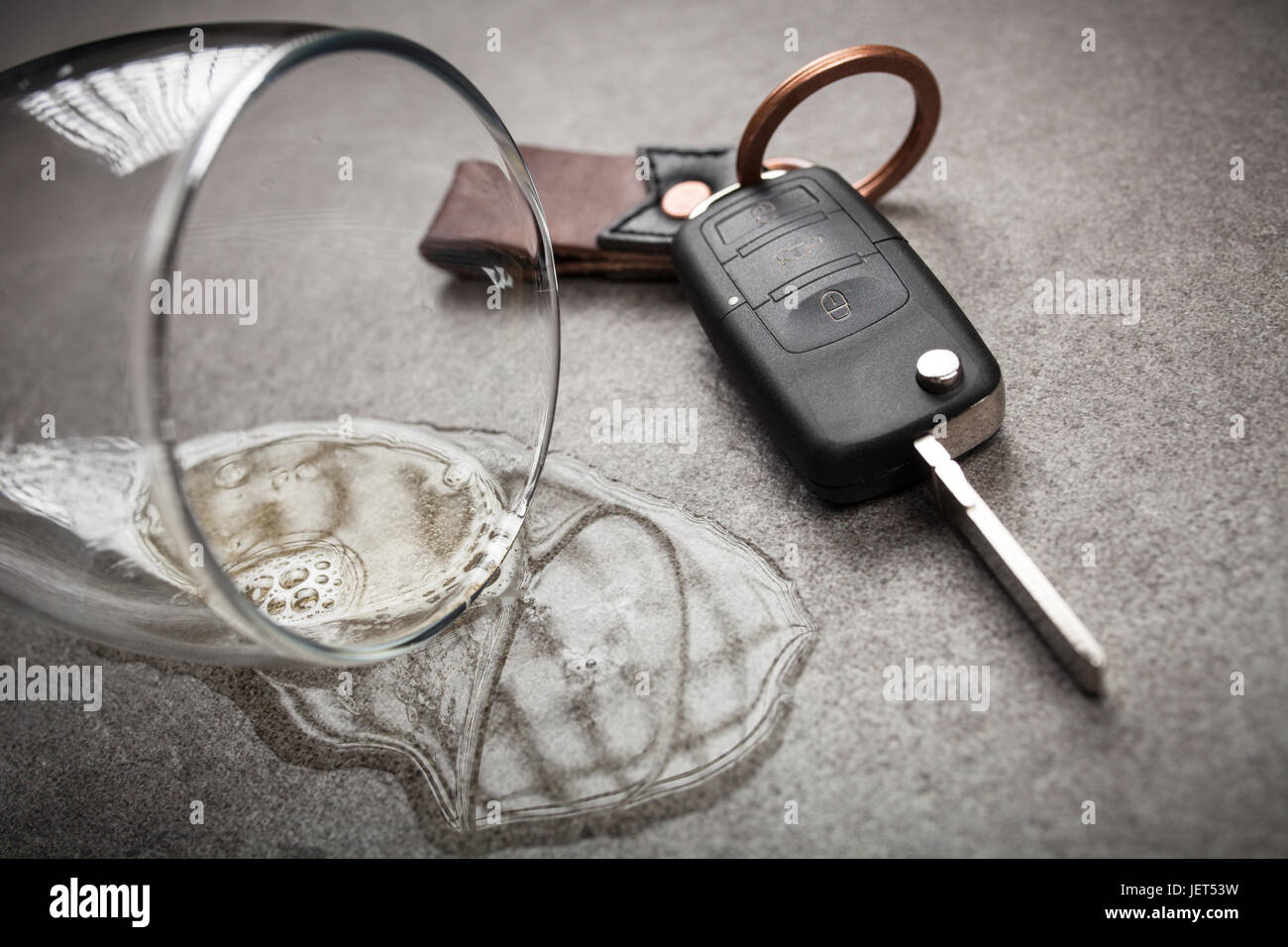 Drunk driving concept spilled beer and car keys on a table Stock