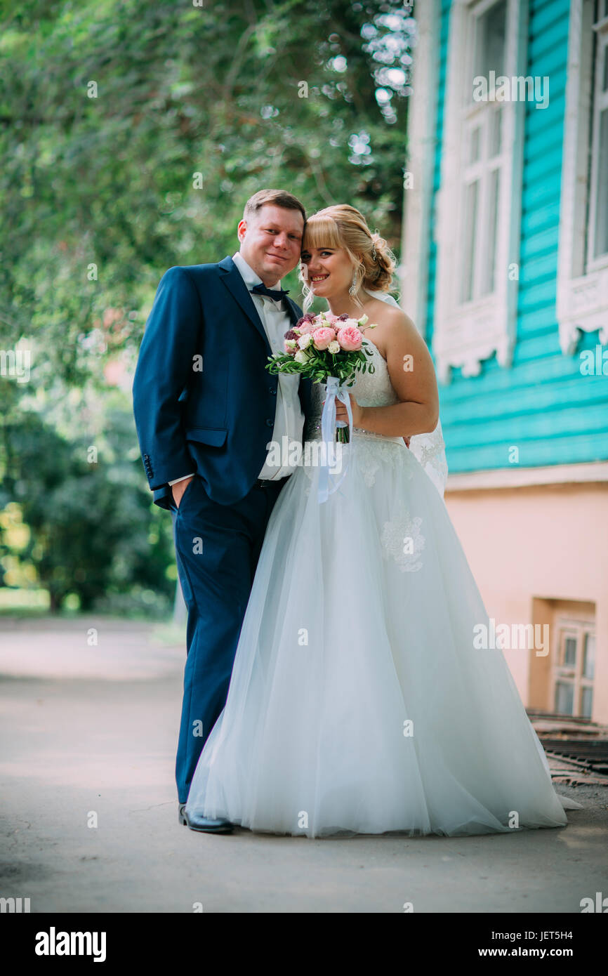 bride and groom on the background of the city Stock Photo - Alamy