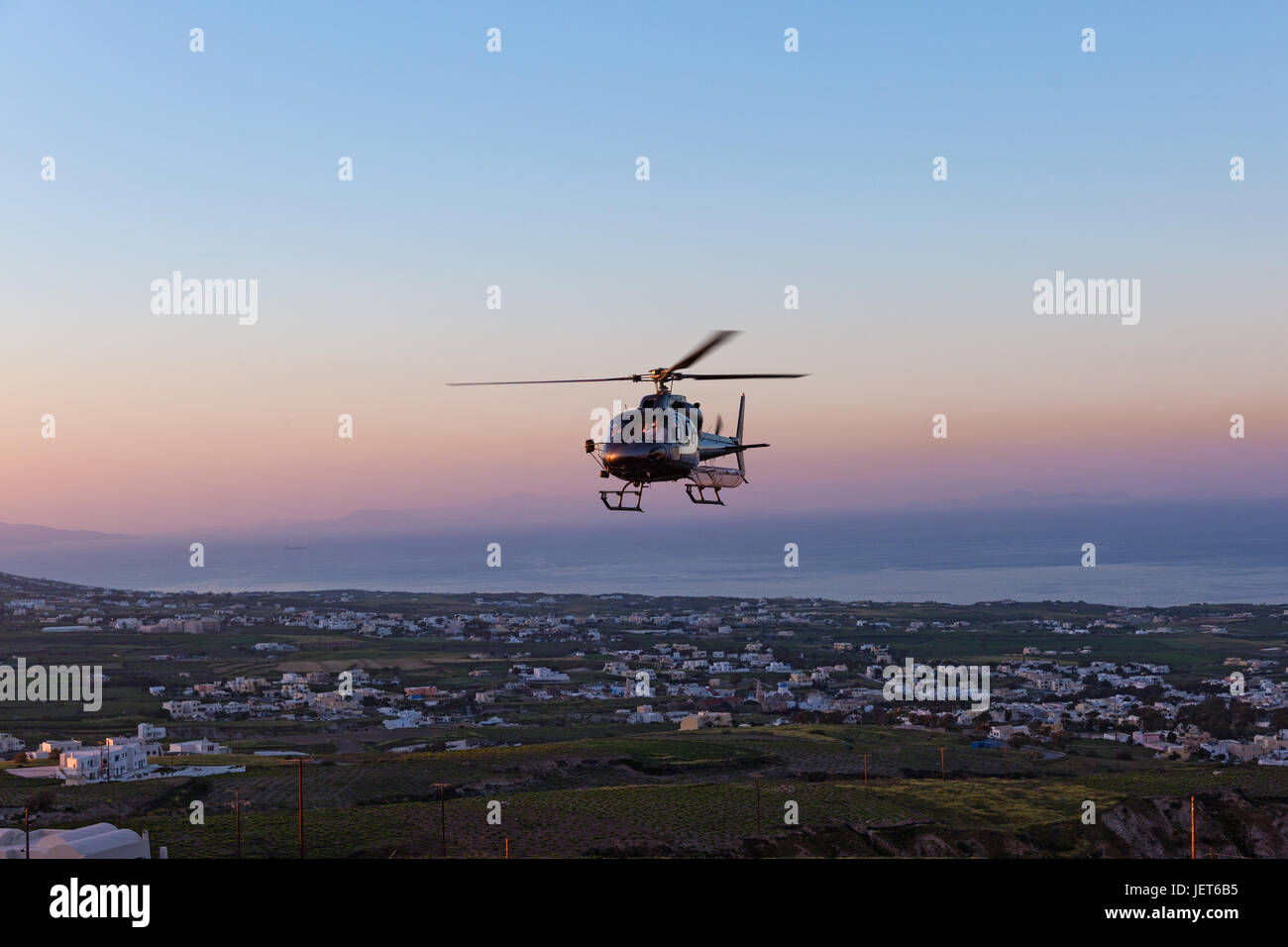 Military helicopter in the fog and comes to a landing spot Stock Photo