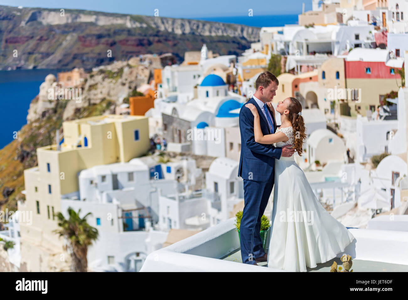 Wedding couple on the background architecture of Santorini Stock Photo
