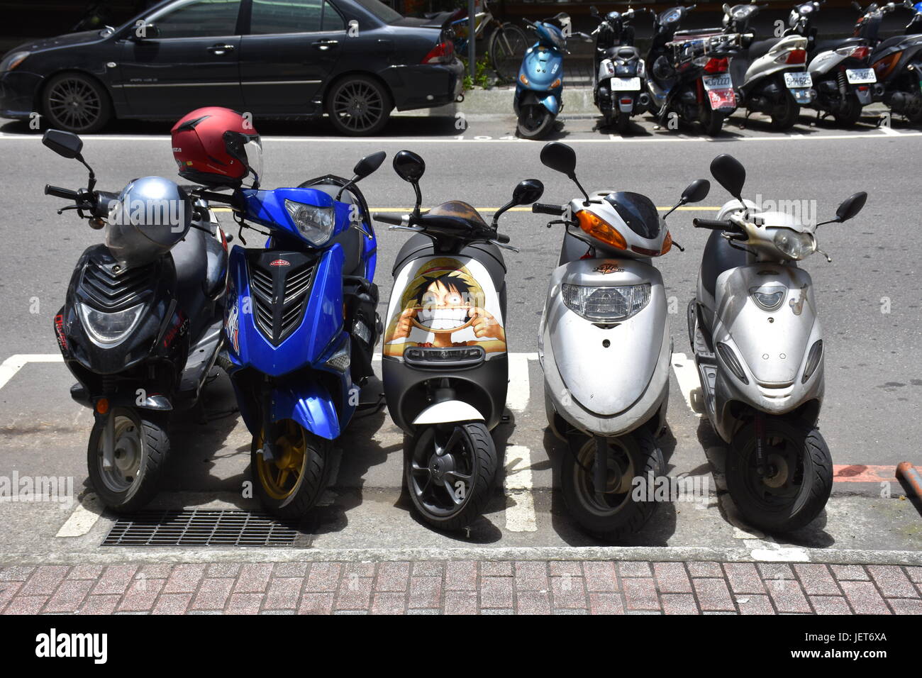 A One Piece scooter with personality stands out from the rest in New Taipei City, Taiwan. Stock Photo