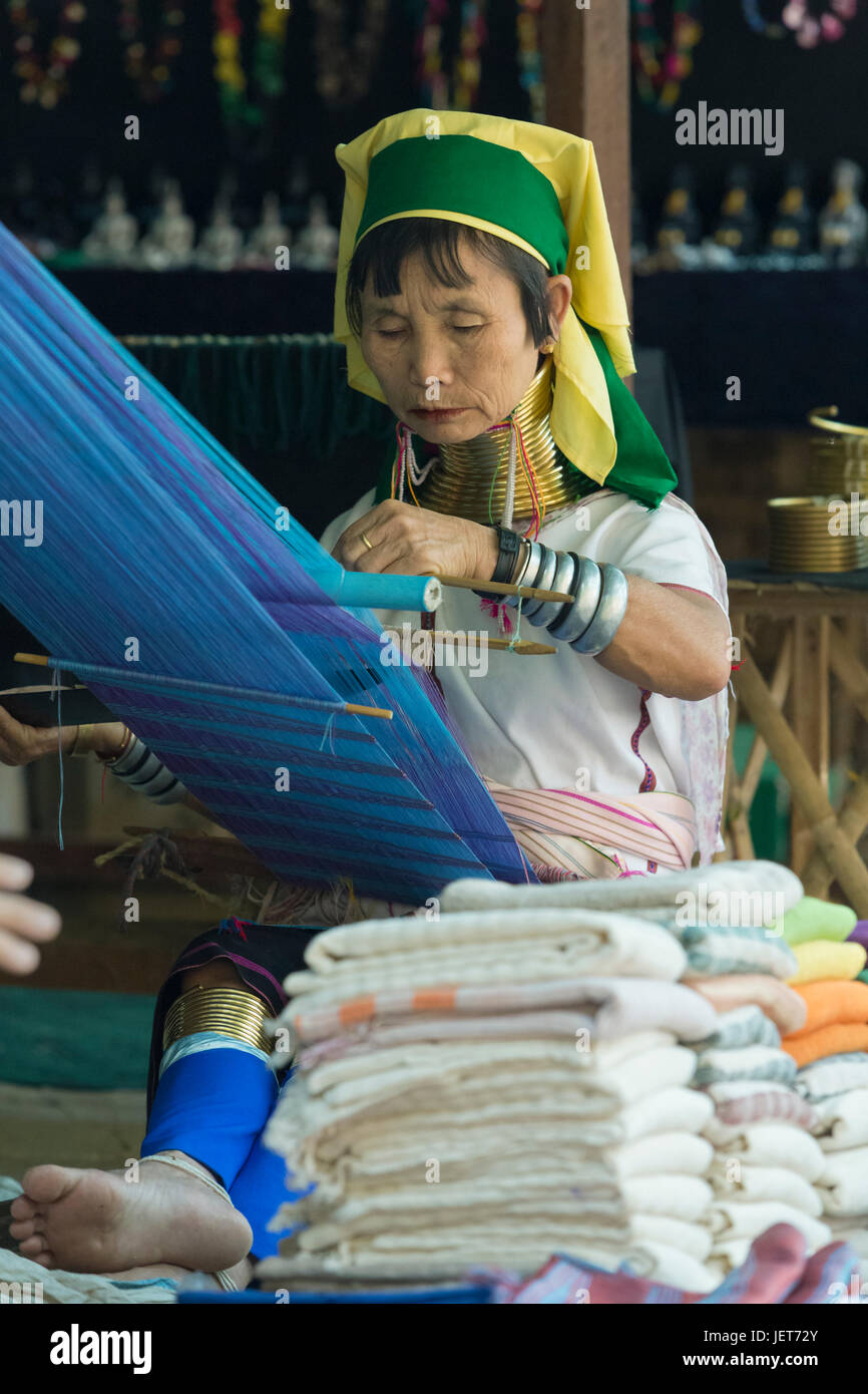 Padaung or long neck woman weaving, Inle lake, Myanmar Stock Photo