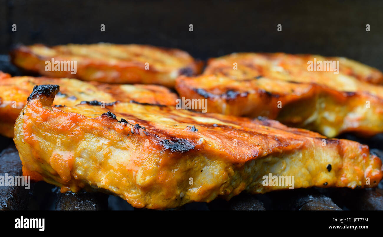 Close up of pork steaks on a gas grill Stock Photo Alamy