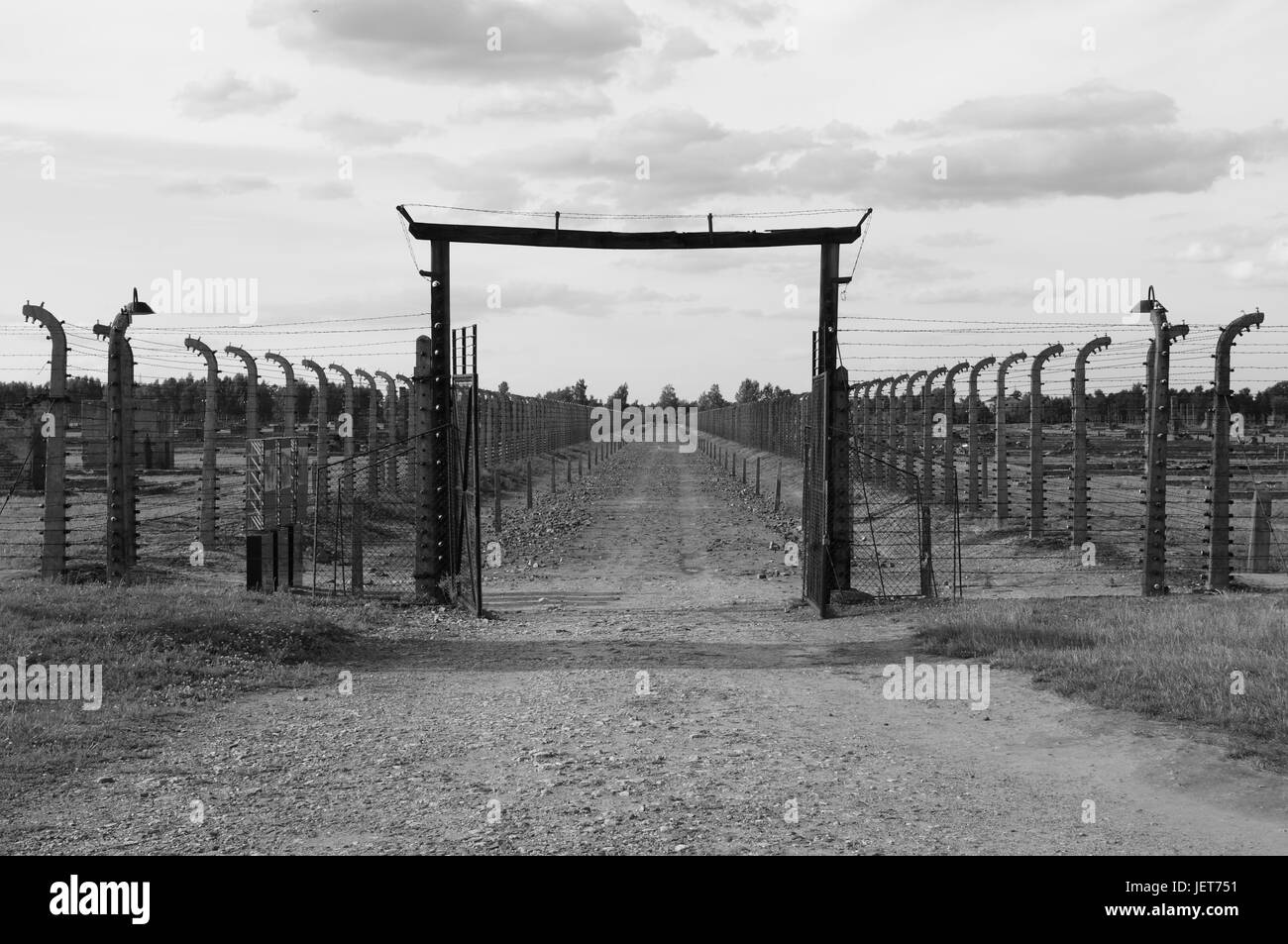 Barbed wire electrical fence at Auschwitz Birkenau, Poland Stock Photo