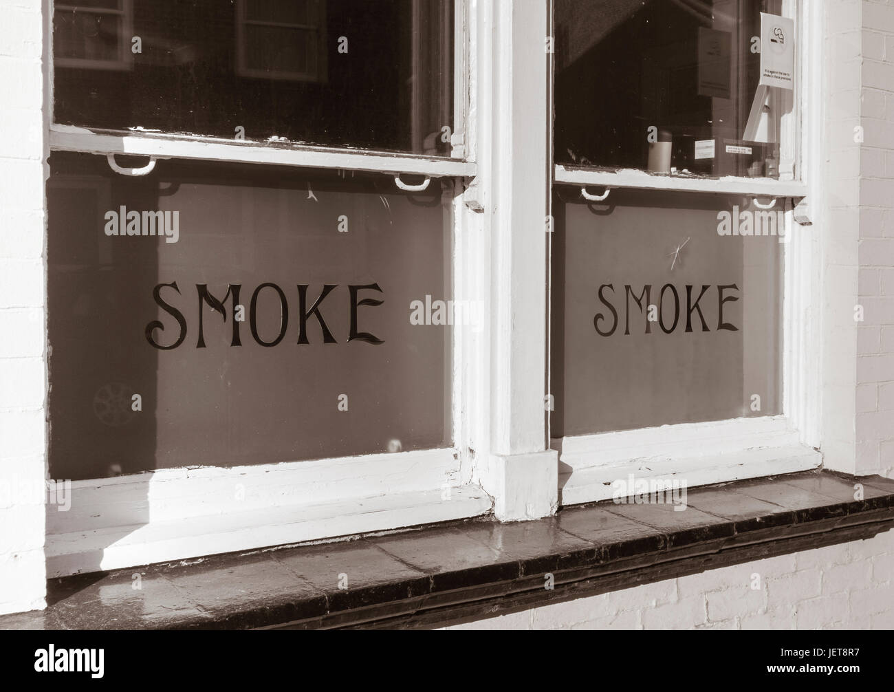 Window of (former) smoke room on old pub in north east England, UK with Stock Photo