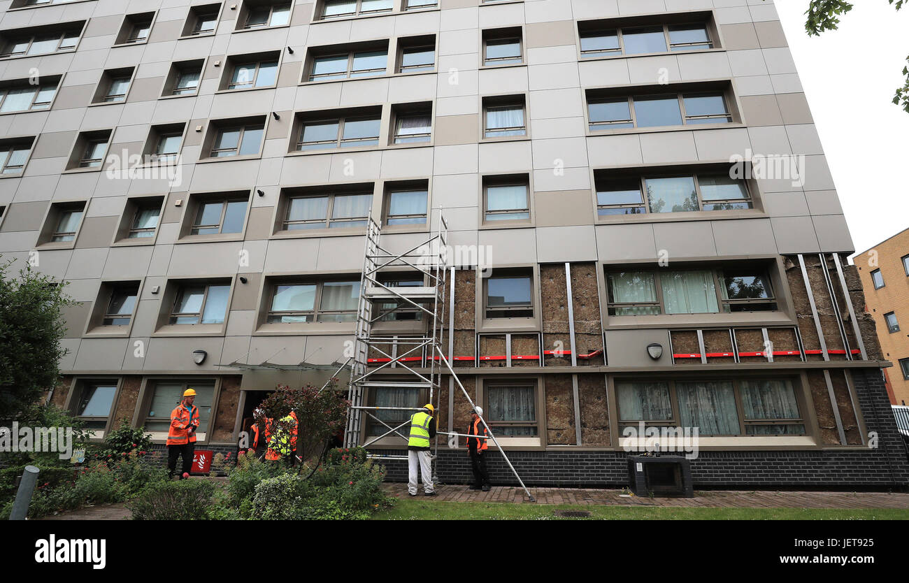 Workmen start to remove cladding on Hornchurch Court, Hulme, Manchester