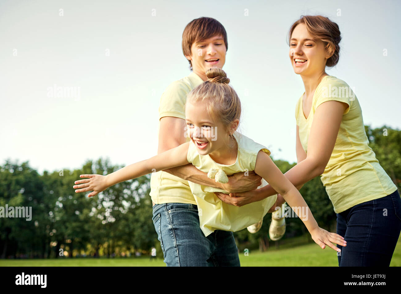 Happy family in the park Stock Photo - Alamy