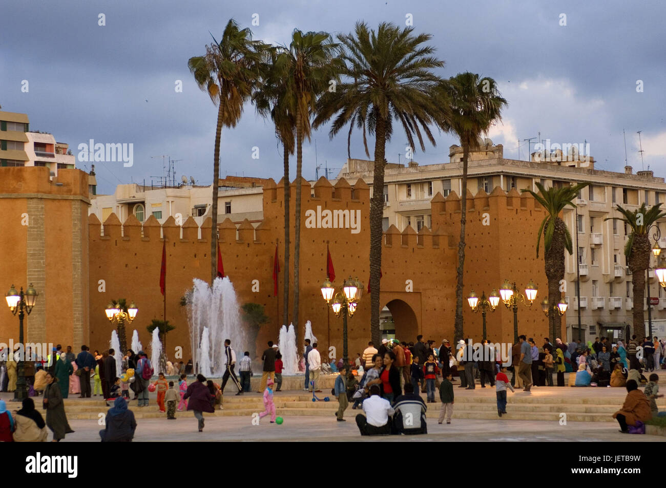 Morocco, Rabat, city wall, square, person, Africa, North Africa, town, part of town, Medina, defensive wall, architecture, flags, palms, lanterns, locals, tourists, men, women, children, leisure time, outside, culture, Stock Photo