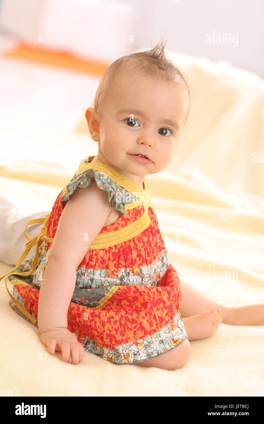 Baby, 6 months, seated, summery, Stock Photo