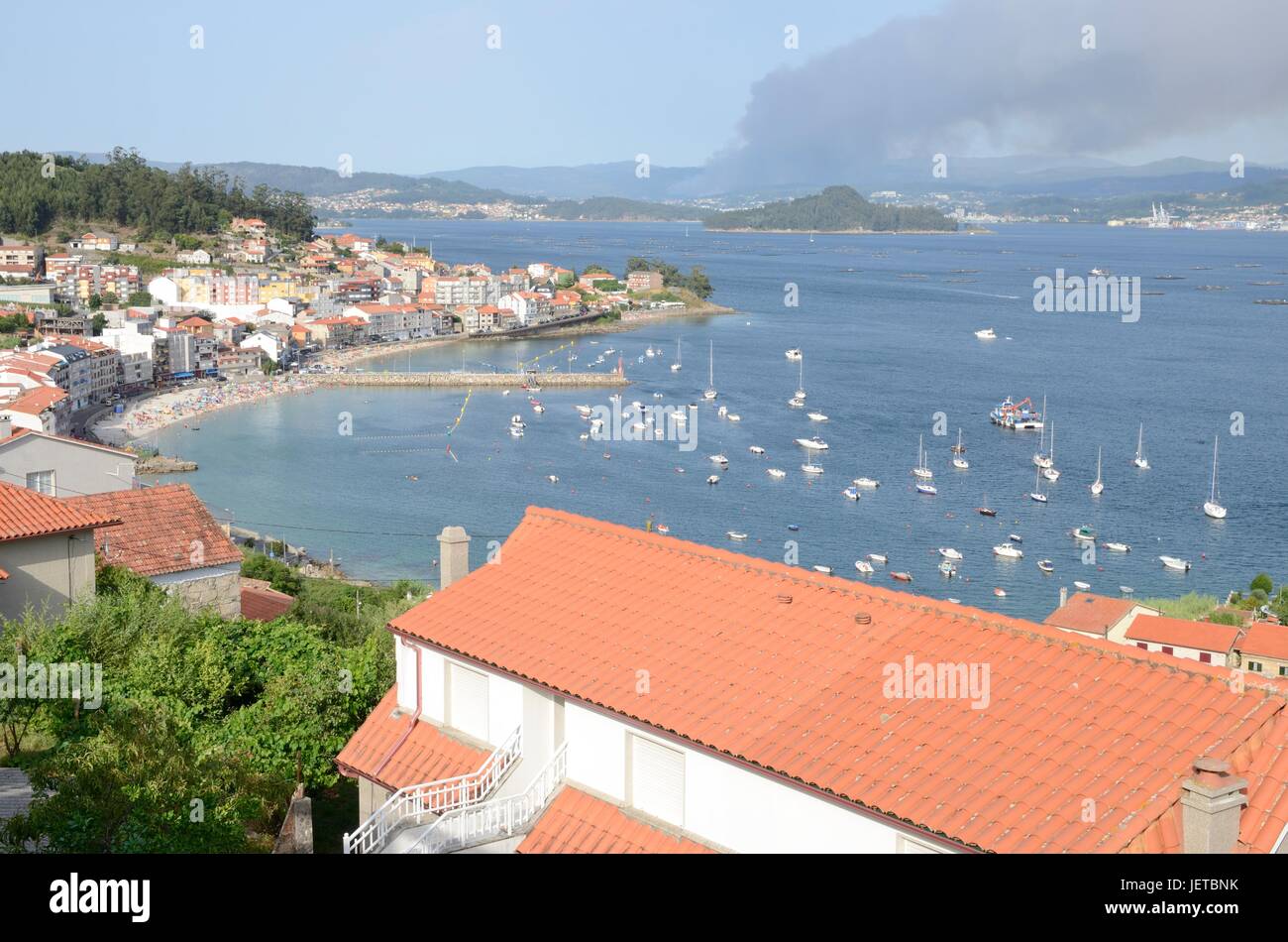Beach and  dock pier of Raxo seen from above in the municipality of Poio, province of Pontevedra, Galicia, Spain. Stock Photo