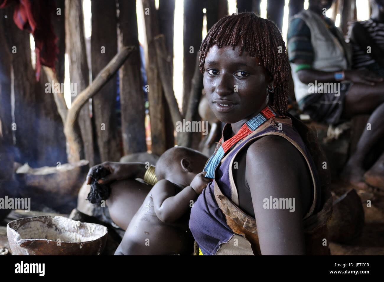Woman, young, baby, tribe Hamar, steelworks, southern Omotal, Ethiopia, Stock Photo