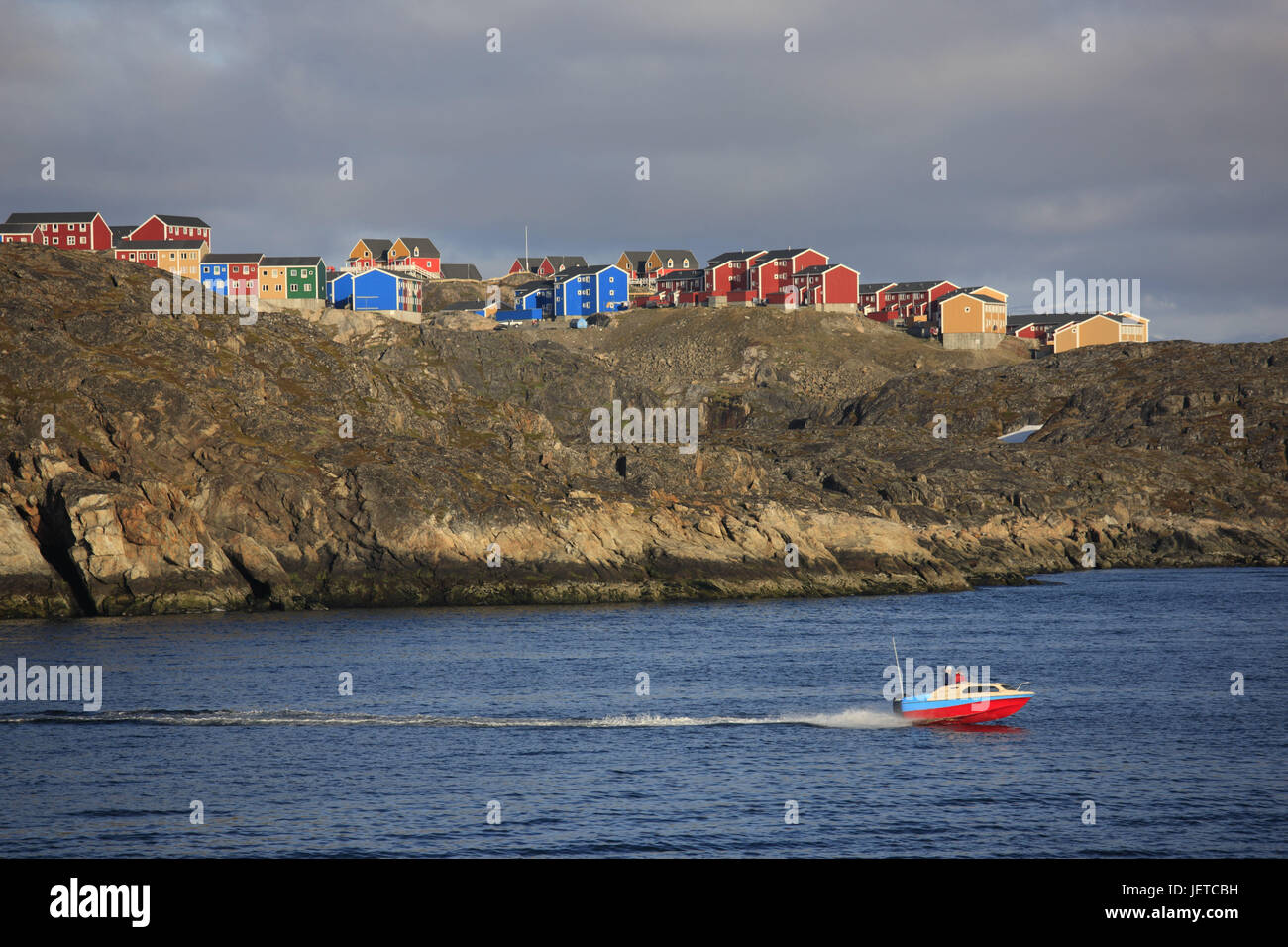 Greenland, Sisimiut, town view, timber houses, bile coast, sea, motorboat, Western Greenland, town, houses, residential houses, brightly, timber-frame construction way, water, boat, coast, rock, sky, cloudies, Stock Photo