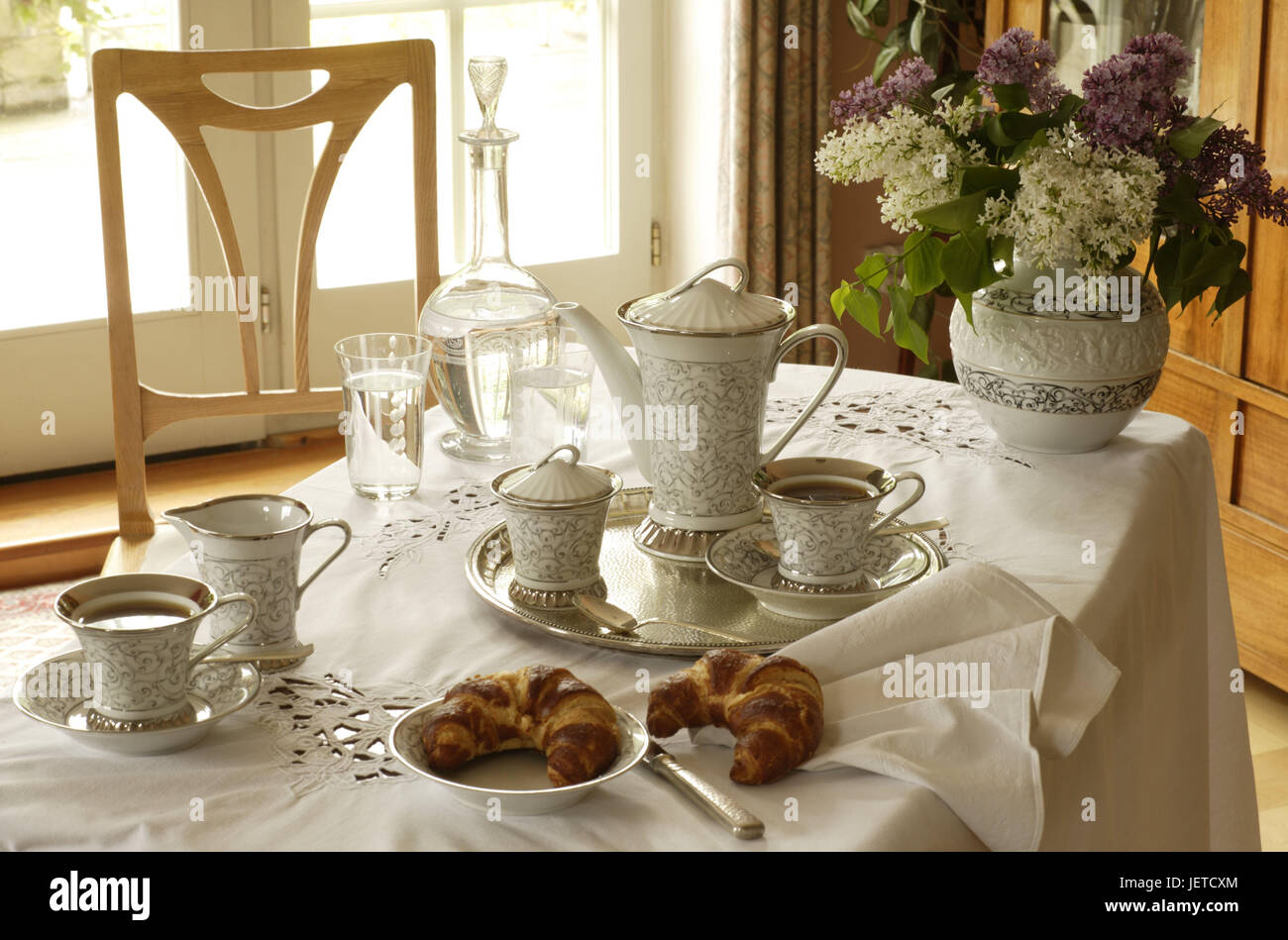 Coffee table, covered, porcelain, elegantly, table, table caps, white, dishes, china, silver tablet, tea service, cups, teapot, tea drinking, Teatime, tea, sugar bowl, decanter, glasses, water, croissants, porcelain vase, vase, lilac, chair, nobody, Stock Photo