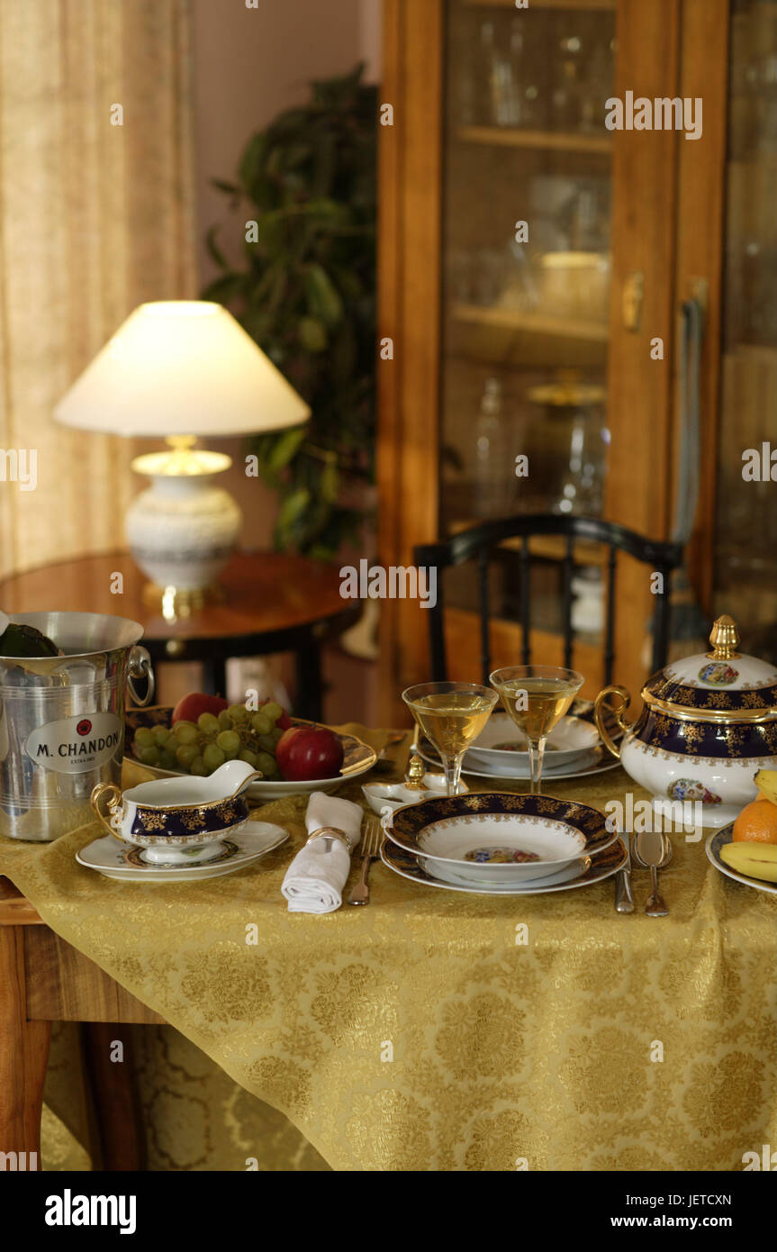 Table, covered, porcelain, elegantly, Sparkling Wine tub, dishes, china, covers, plates, flatware, substance napkin, table caps, golden, festively, sauceboat, soup tureen, tureen, champagne, wine, cooling, wineglasses, glasses, fruit, grapes, apples, lamp, lighting, chair, nobody, Stock Photo