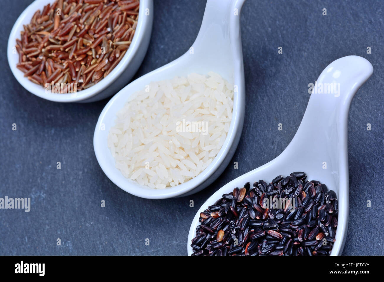 Slate Rice Various types of rice in a spoons on slate close-up Stock Photo - Alamy