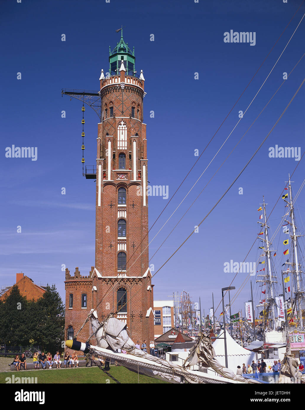 Germany, Bremerhaven, new harbour, big lighthouse, outside, tourists, North Germany, town, harbour, Simon Loschen tower, Loschenturm, lighthouse, sea character, landmark, sea character, architecture, brick, brick Gothic, navigation, ship, place of interest, tourism, person, sky, blue, sunshine, Stock Photo