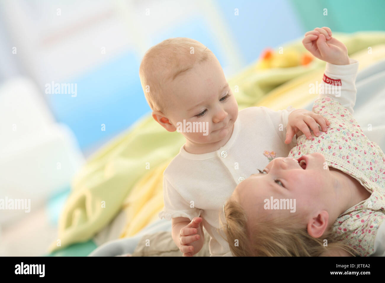 Siblings, baby, 5 months, infant, 2.5 years, play, Stock Photo