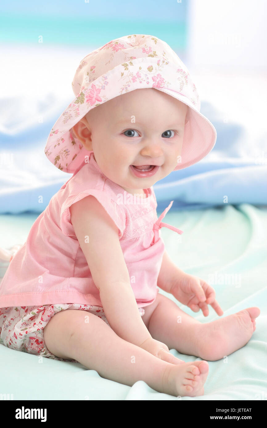 Baby, 6 months, seated, summery, solar hat, Stock Photo