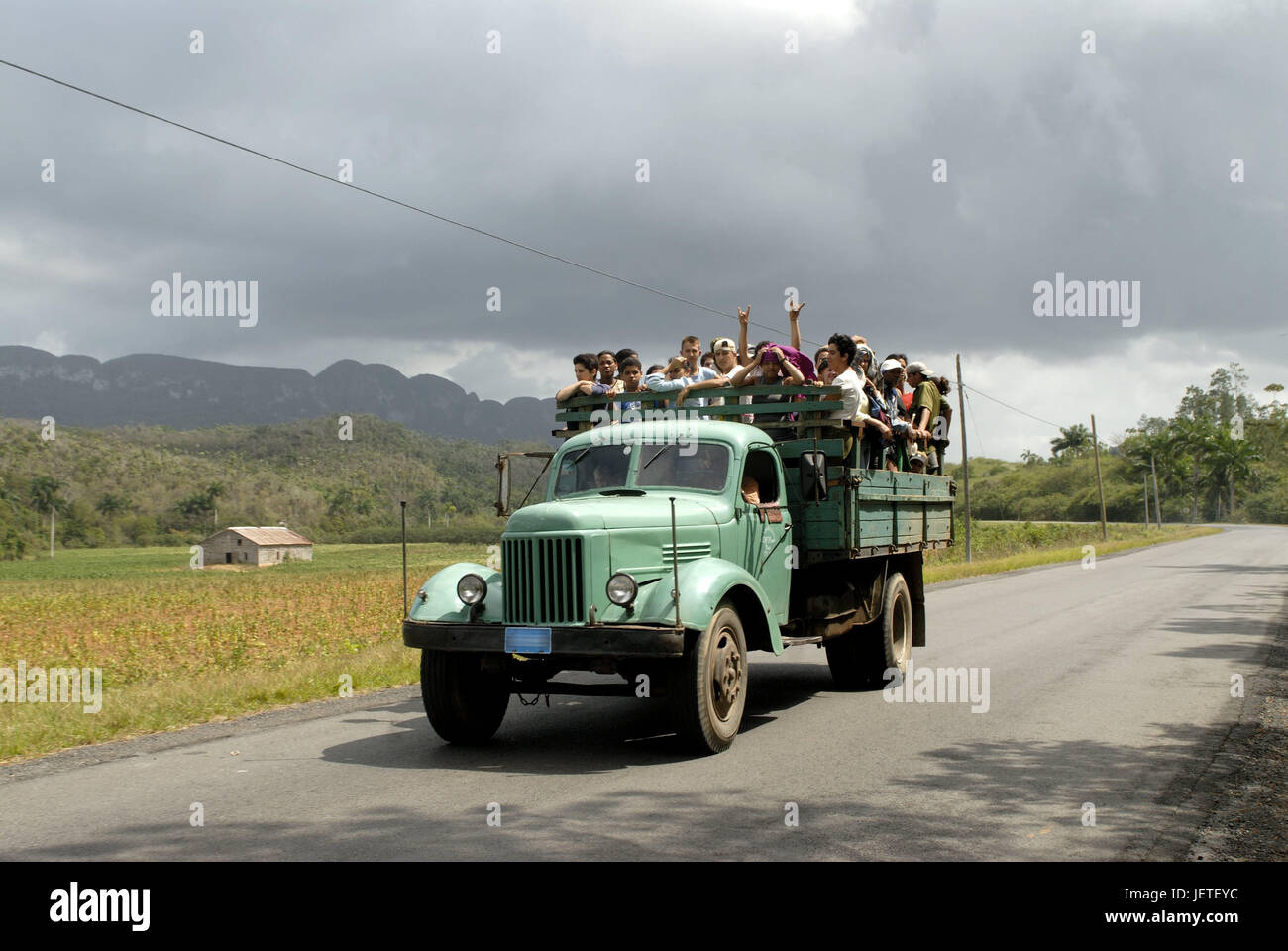 Cuba, Vinales, street, truck, loading area, crowd of people, the Caribbean, island, street, traffic, vehicle, truck, tourist, schoolboy, person, transport, promotion, transportation of human beings, typically for country, means of transportation, outside, destination, tourism, Stock Photo